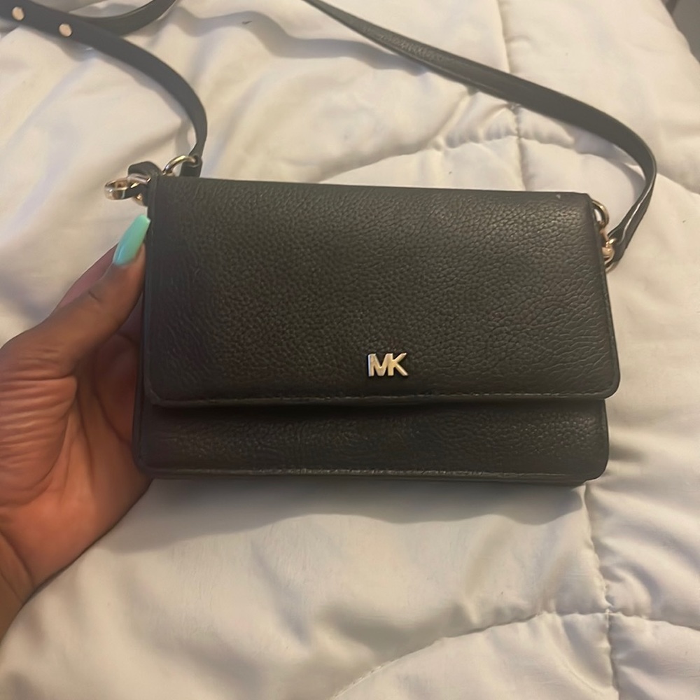 Black mini shoulder purse with plenty of card space and extra pockets.